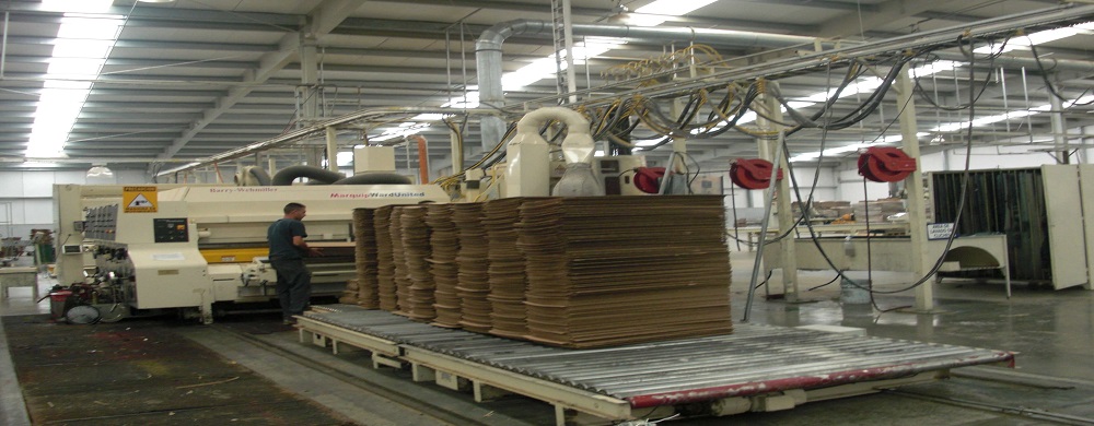 How does the cardboard factory need to develop its business