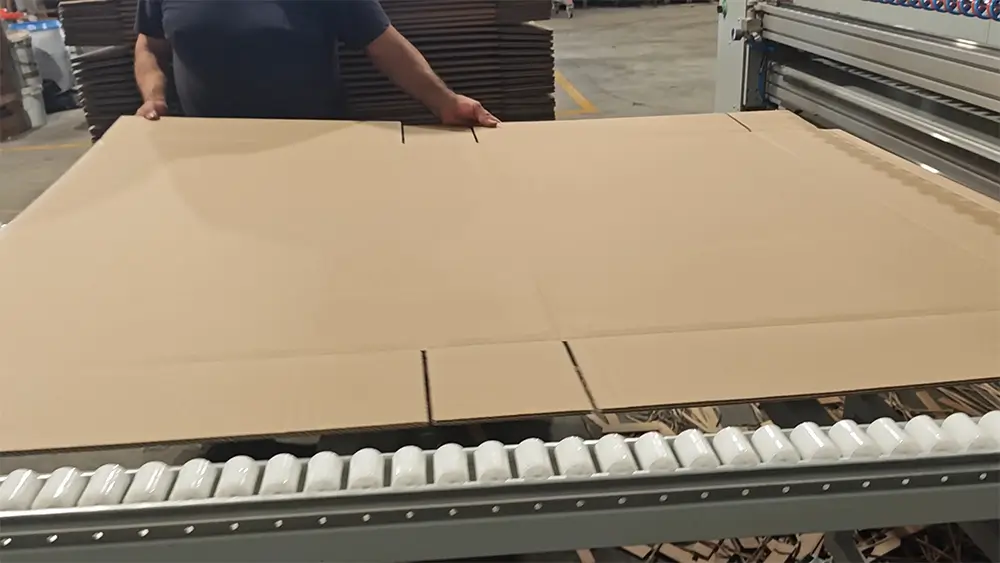 High-precision box making machine finishing a custom-sized corrugated box