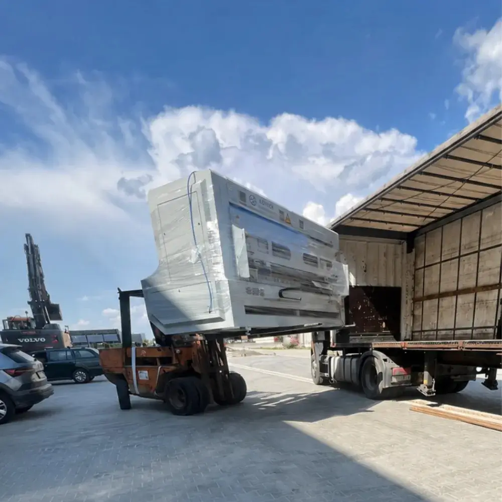 BM3000-HD box making machine being moved by forklift during relocation in Poland